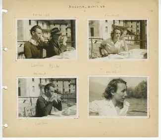 photographie d’André Gide, avec lunettes et chapeau, et Jean Lambert, attablés, buvant tous deux dans une tasse, en extérieur, avril 1947